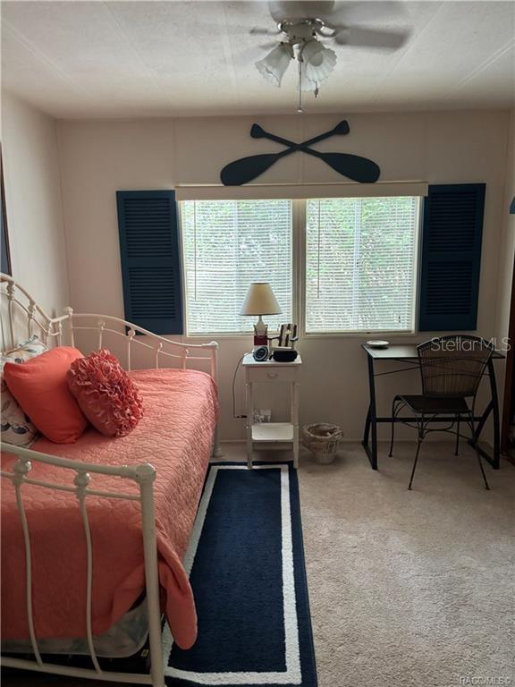 14334 Midfield Street Brooksville, FL 34613 - Photo 28 of 48 a bedroom with a bed and a large window