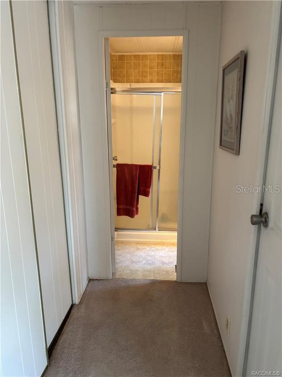 14334 Midfield Street Brooksville, FL 34613 - Photo 35 of 48 a view of a hallway with wooden door