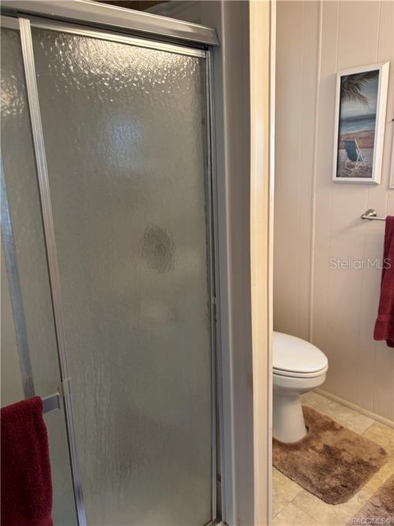 14334 Midfield Street Brooksville, FL 34613 - Photo 38 of 48 a white toilet sitting next to a shower