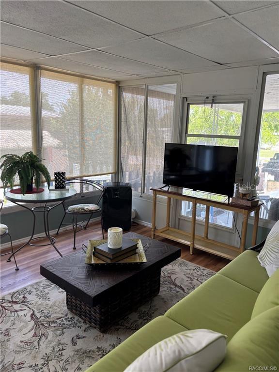 14334 Midfield Street Brooksville, FL 34613 - Photo 39 of 48 a living room with furniture and a flat screen tv