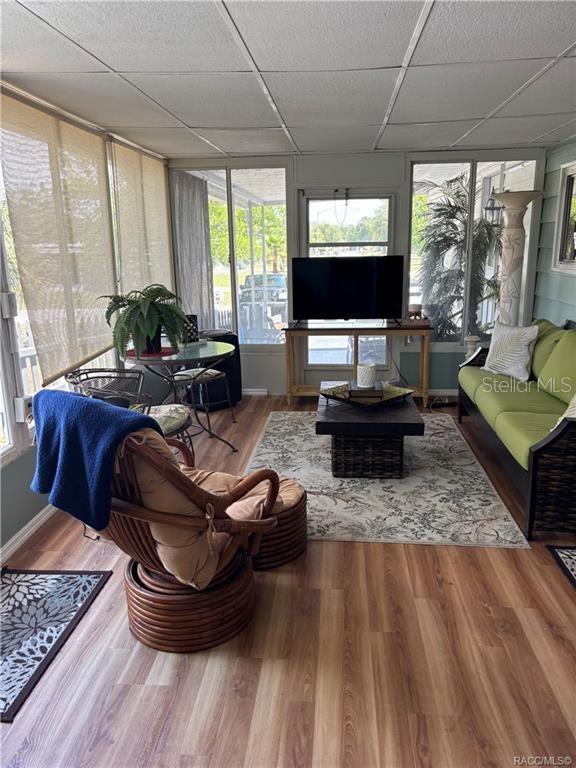 14334 Midfield Street Brooksville, FL 34613 - Photo 40 of 48 a living room with furniture and a flat screen tv