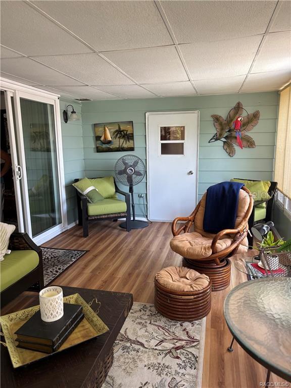 14334 Midfield Street Brooksville, FL 34613 - Photo 41 of 48 a living room with furniture and wooden floor
