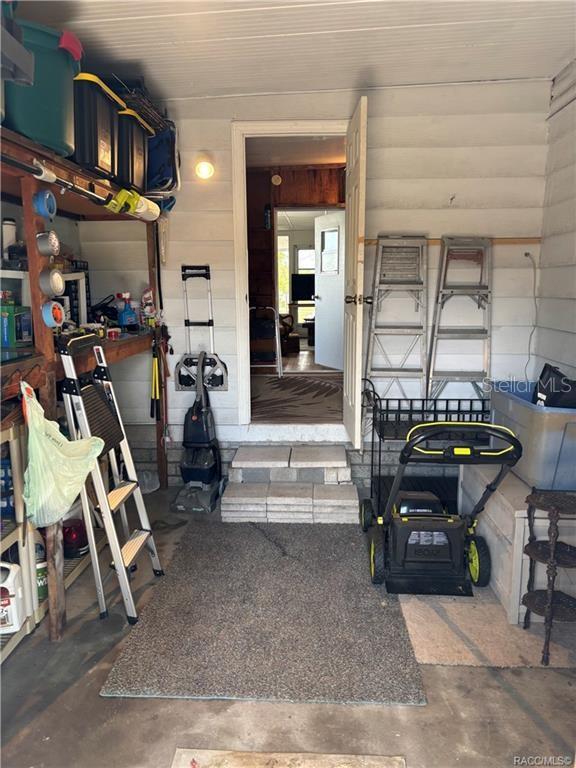 14334 Midfield Street Brooksville, FL 34613 - Photo 48 of 48 a living room with furniture a piano and wooden floor
