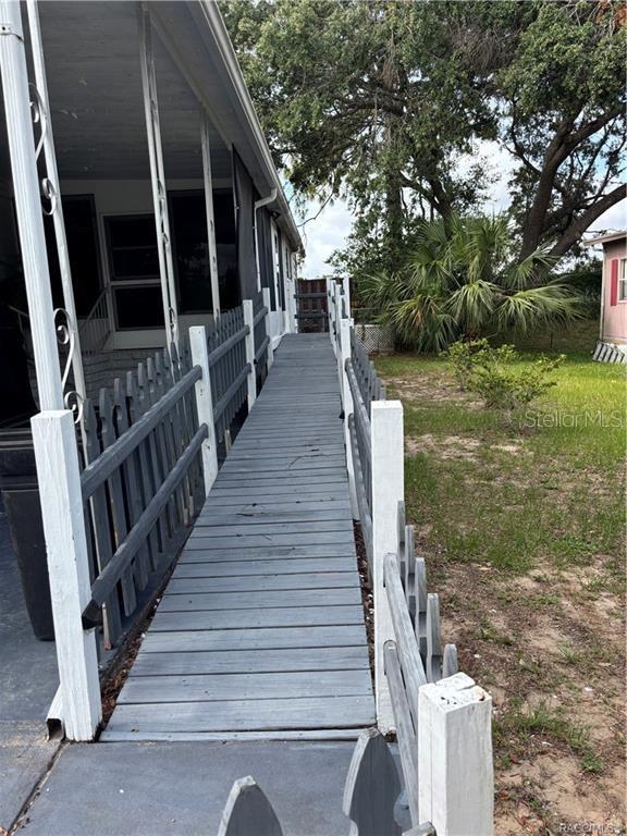 14334 Midfield Street Brooksville, FL 34613 - Photo 5 of 48 a view of deck with patio door and porch