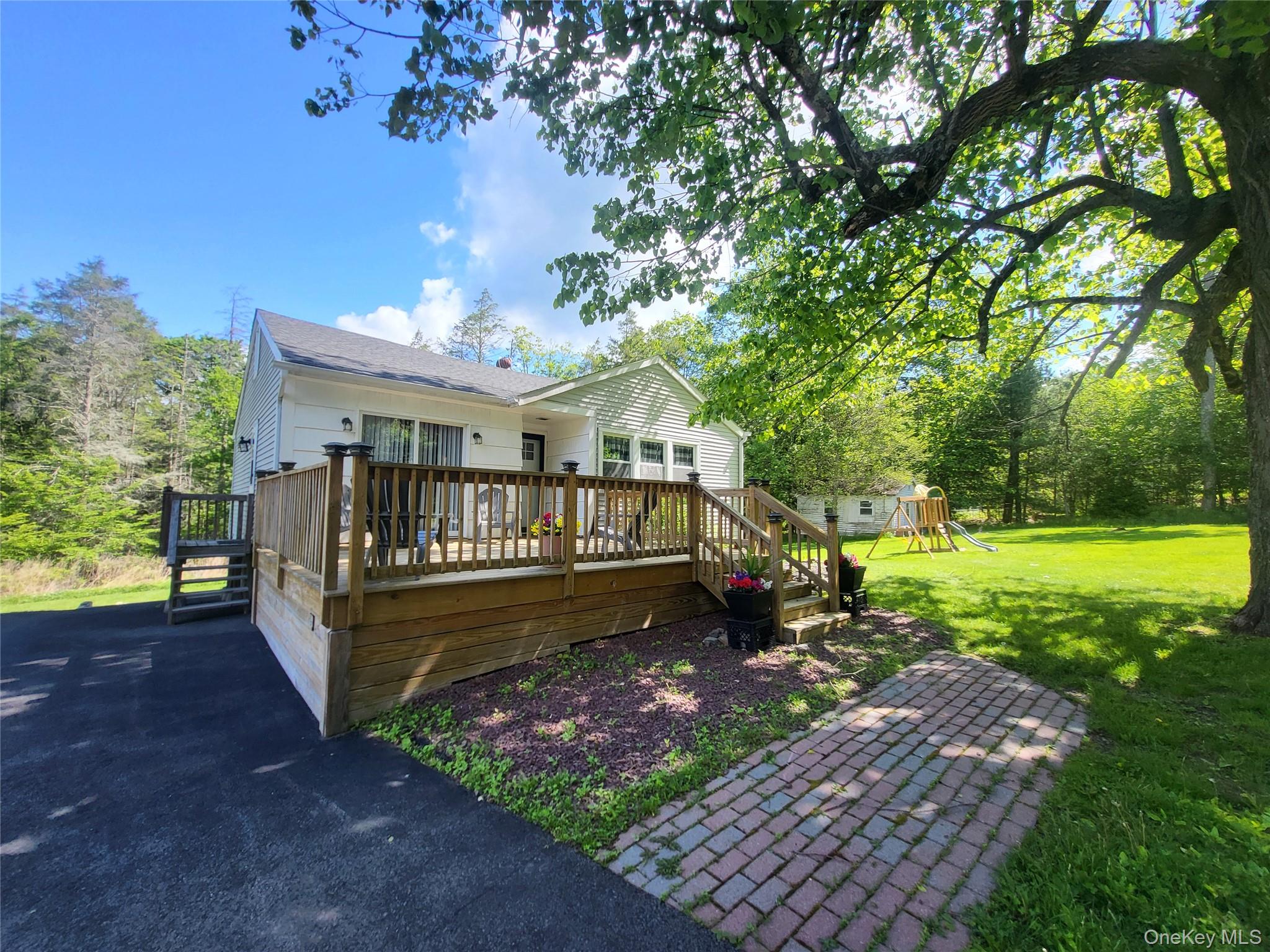 286 Dingle Daisy Road Monticello, NY 12701 - Photo 32 of 35 a view of a house with a yard