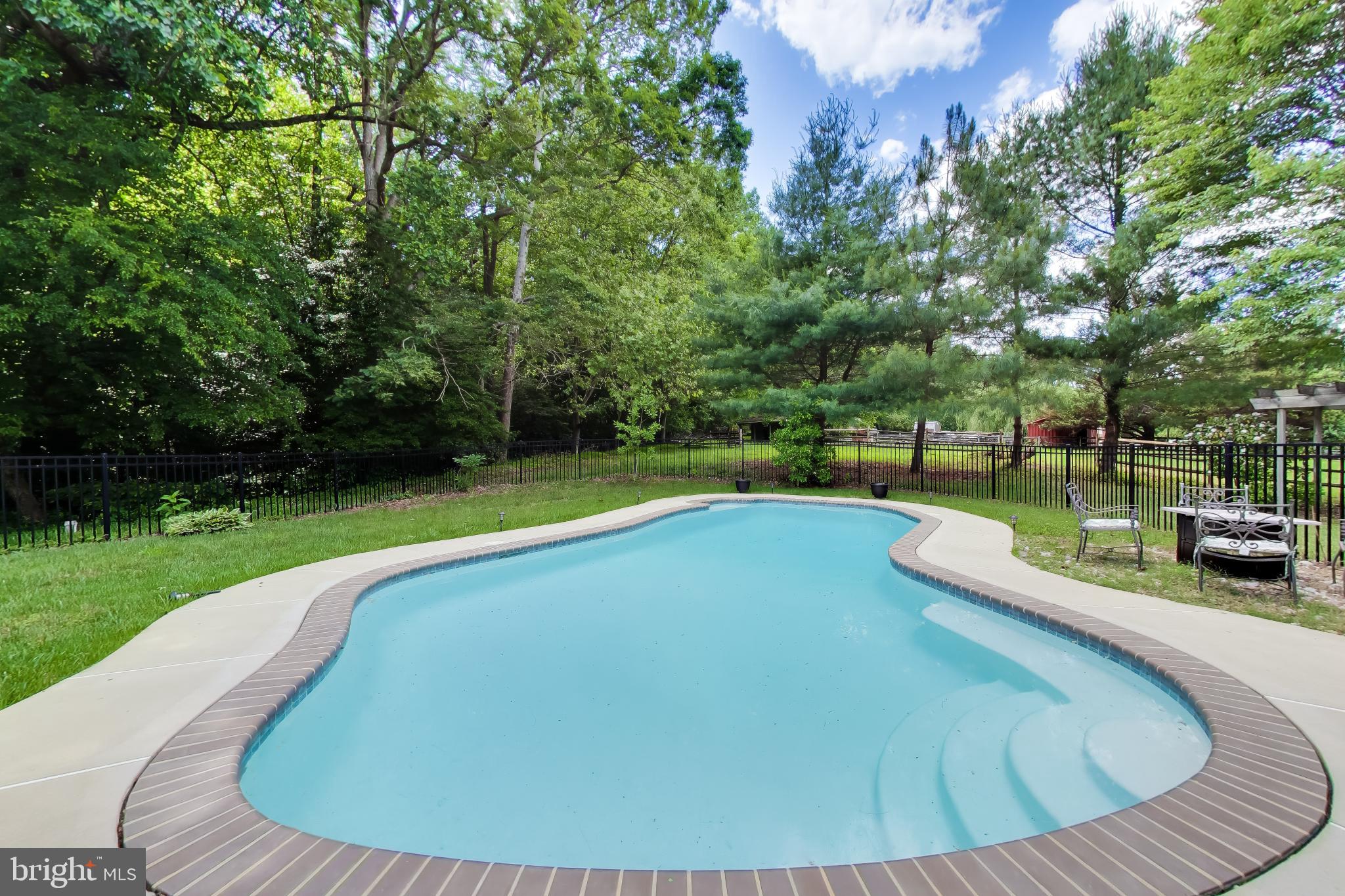 3240 Juniper Lane Huntingtown, MD 20639 - Photo 2 of 48 a view of a swimming pool with a patio