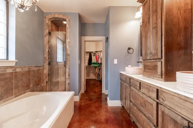 a bathroom with a bathtub and a sink