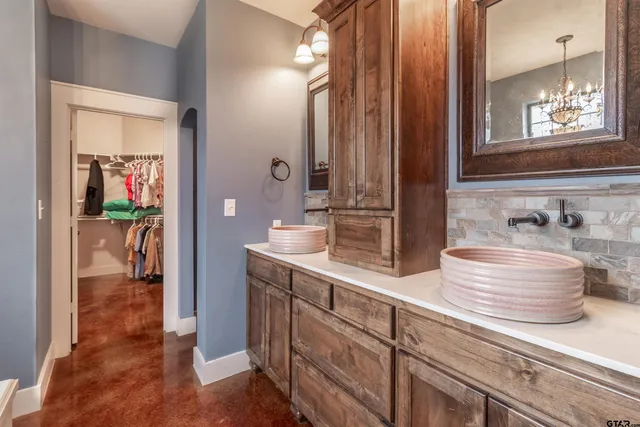 a en suite bathroom with a sink and mirror