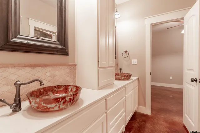 a bathroom with a sink and a mirror