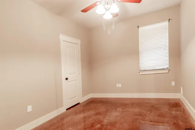 a view of a livingroom with a hall and a window