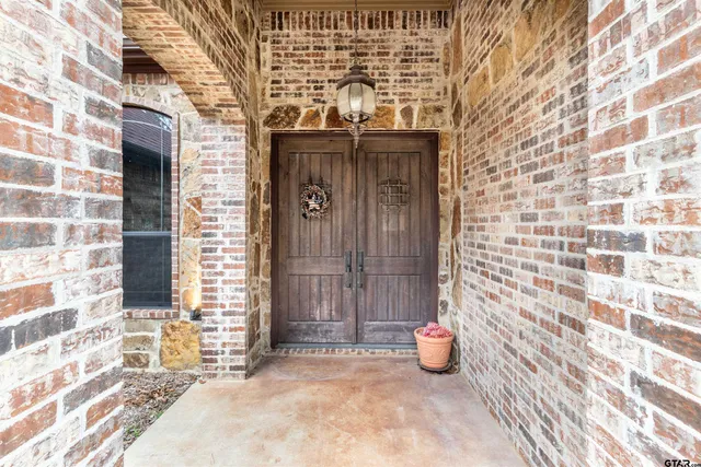 a view of a door and chair and table