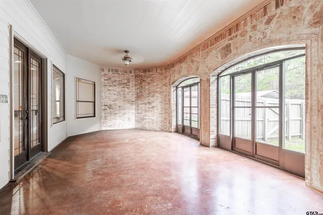 a view of an empty room with a balcony
