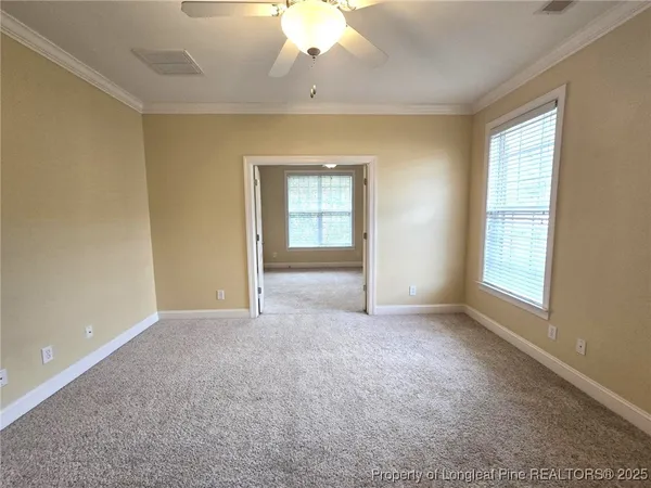 an empty room with a empty space and windows