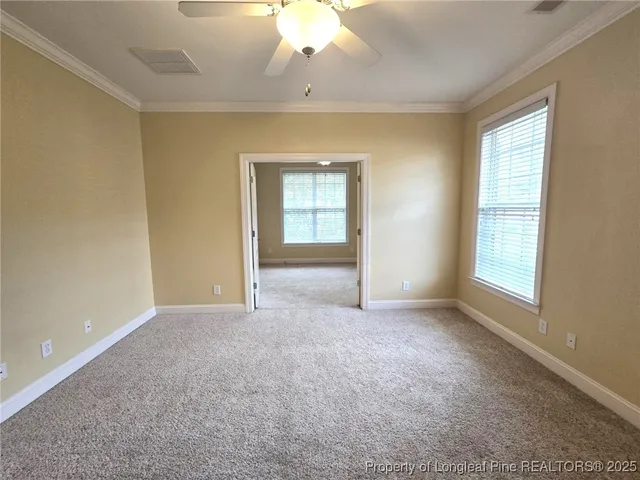 an empty room with a empty space and windows