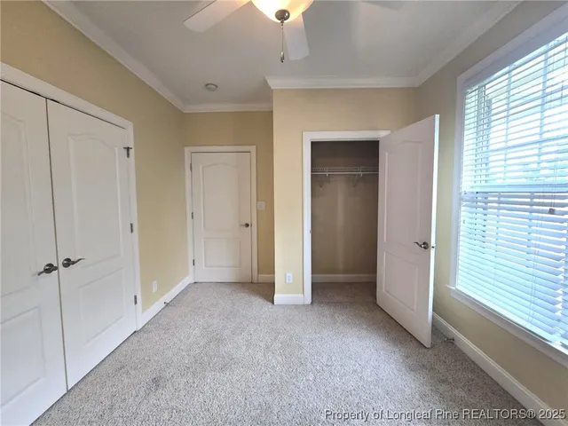 a view of empty room with a fireplace