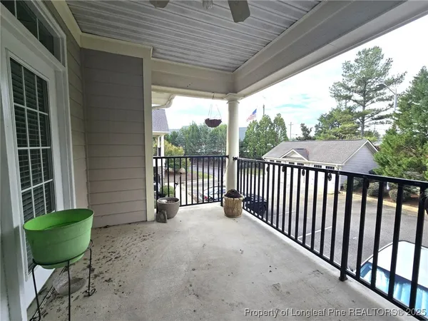 a view of a chair and table in the balcony