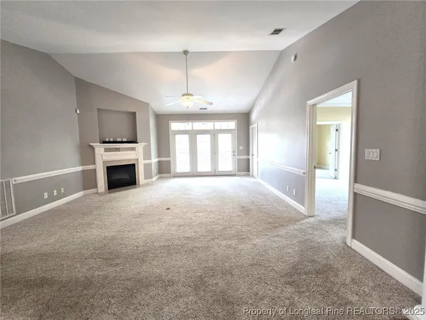 a large kitchen with window and stainless steel appliances