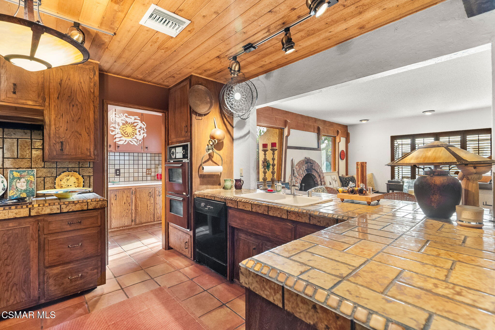 3509 Amarillo Avenue Simi Valley, CA 93063 - Photo 12 of 30 a kitchen with stainless steel appliances granite countertop a sink and cabinets