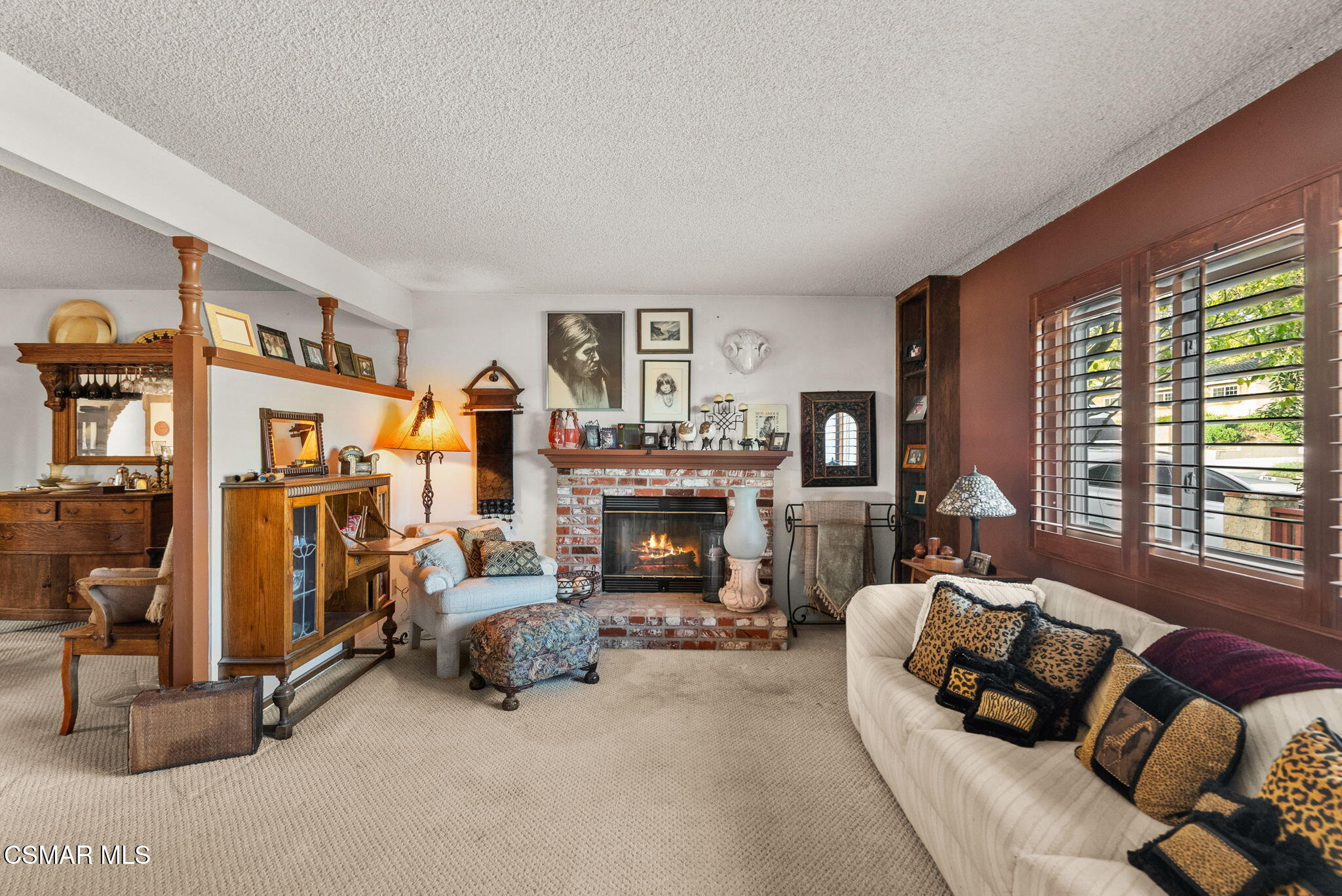 3509 Amarillo Avenue Simi Valley, CA 93063 - Photo 17 of 30 a living room with furniture and a fireplace