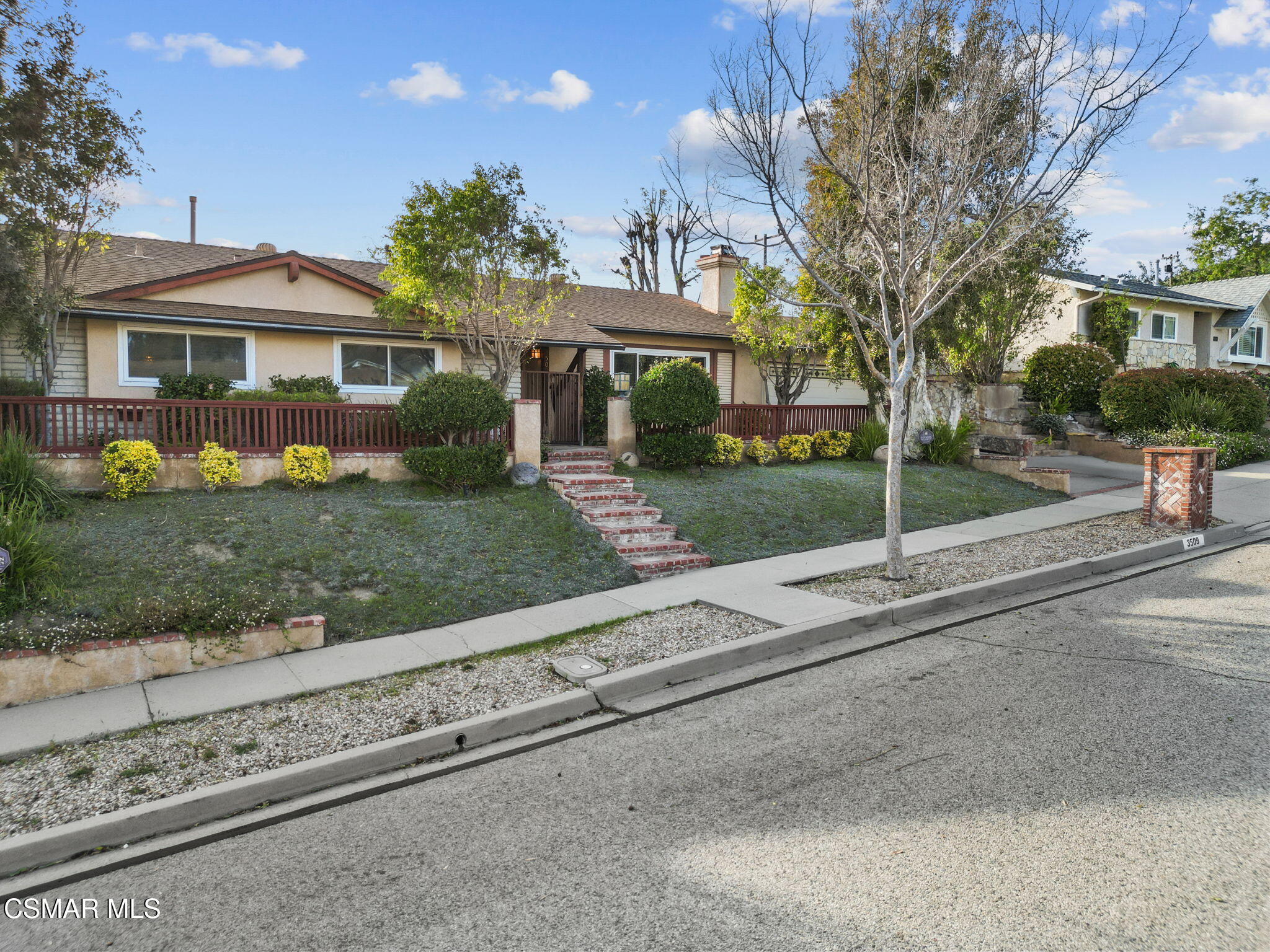 3509 Amarillo Avenue Simi Valley, CA 93063 - Photo 2 of 30 a front view of house with yard and green space