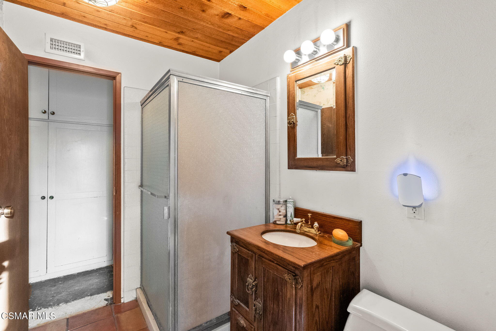 3509 Amarillo Avenue Simi Valley, CA 93063 - Photo 24 of 30 a bathroom with a granite countertop sink toilet and mirror