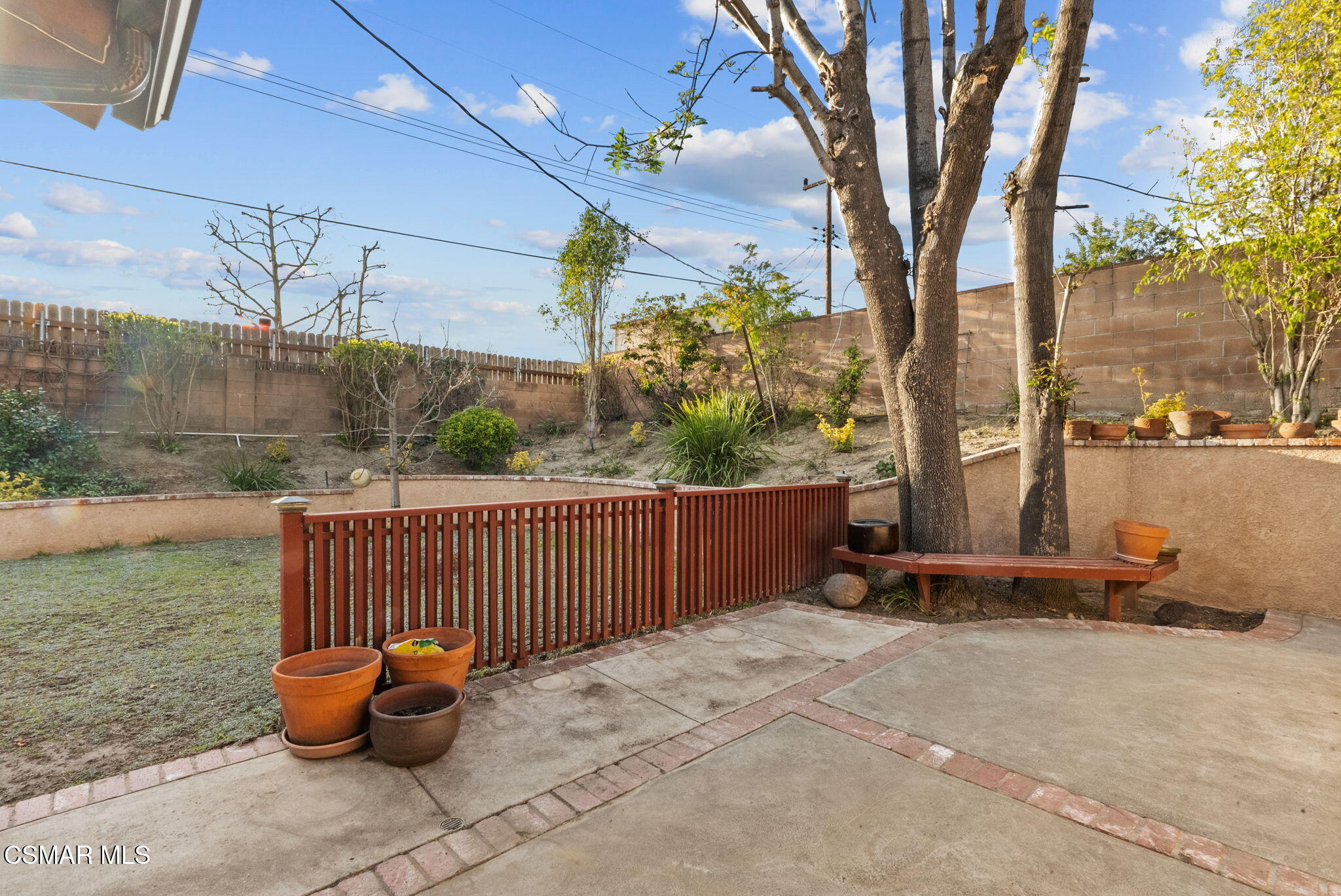 3509 Amarillo Avenue Simi Valley, CA 93063 - Photo 28 of 30 a view of a patio with a table and chairs and potted plants