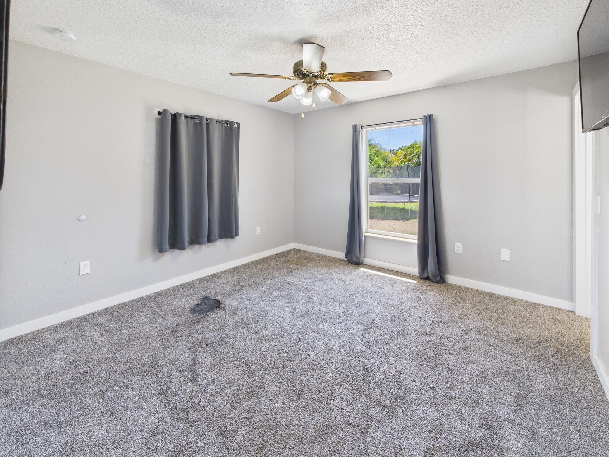 6504 Southeast 86th Boulevard Okeechobee, FL 34974 - Photo 23 of 38 a view of an empty room with a window
