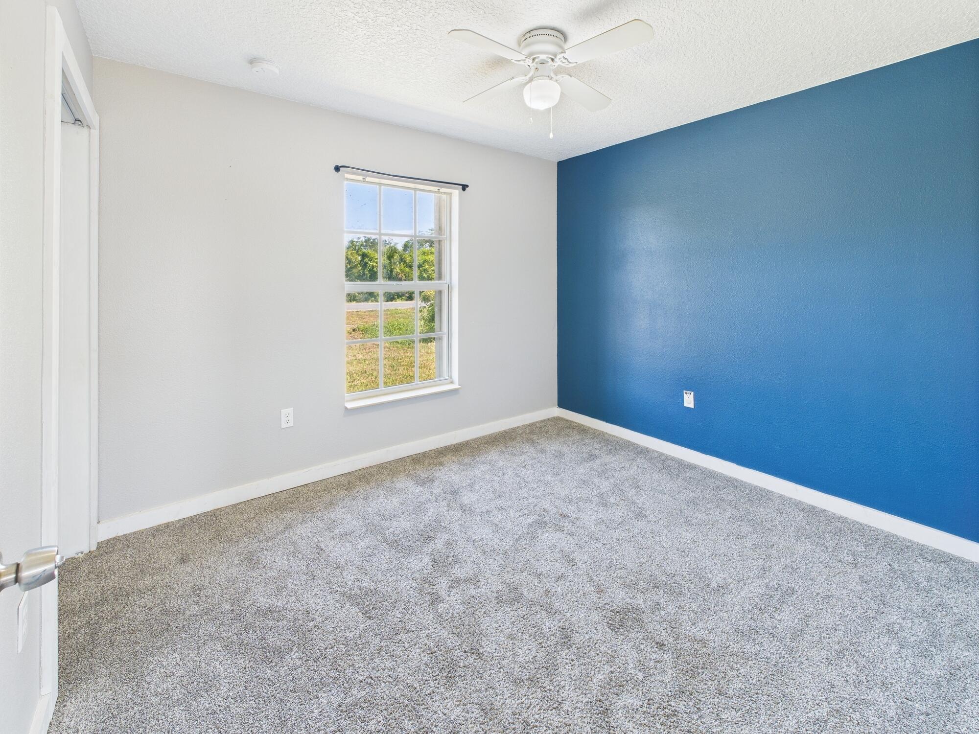6504 Southeast 86th Boulevard Okeechobee, FL 34974 - Photo 27 of 38 an empty room with a window