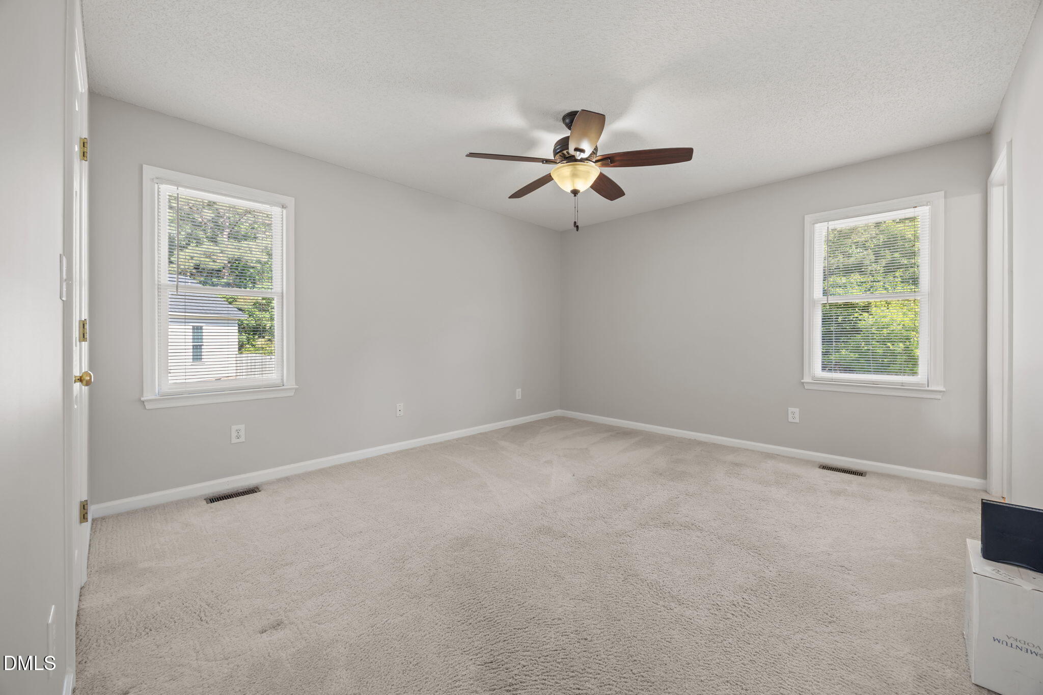 40 Circle Tree Lane Angier, NC 27501 - Photo 20 of 39 an empty room with a window and a fan