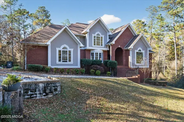 a front view of a house with a yard