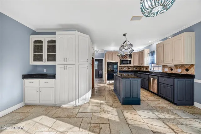a spacious bathroom with a granite countertop sink mirror and bathtub