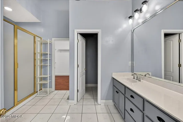 a bedroom with a bed and a table