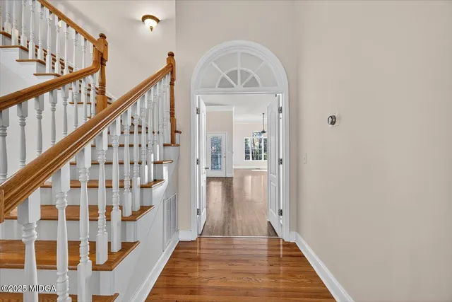 a view of front door with wooden floor