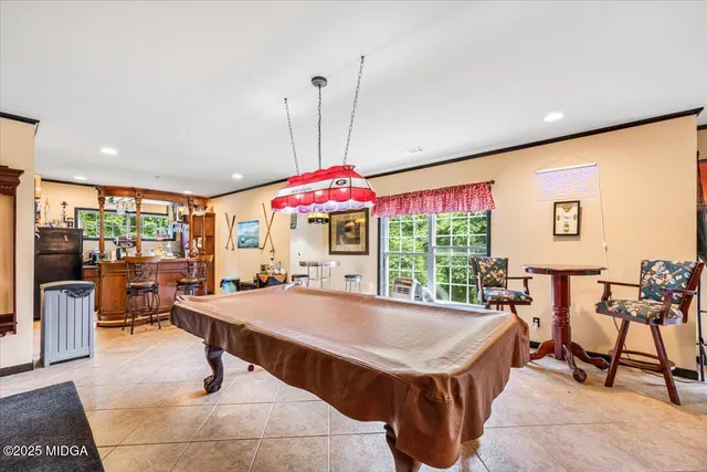 a view of a house with sitting area and garden
