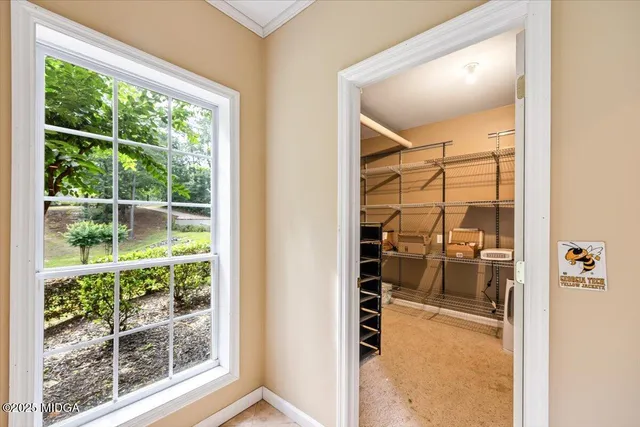 a front view of a house with swimming pool garden and patio