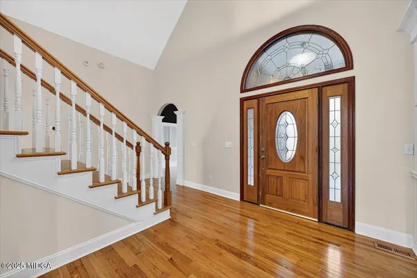 a view of entryway with wooden floor