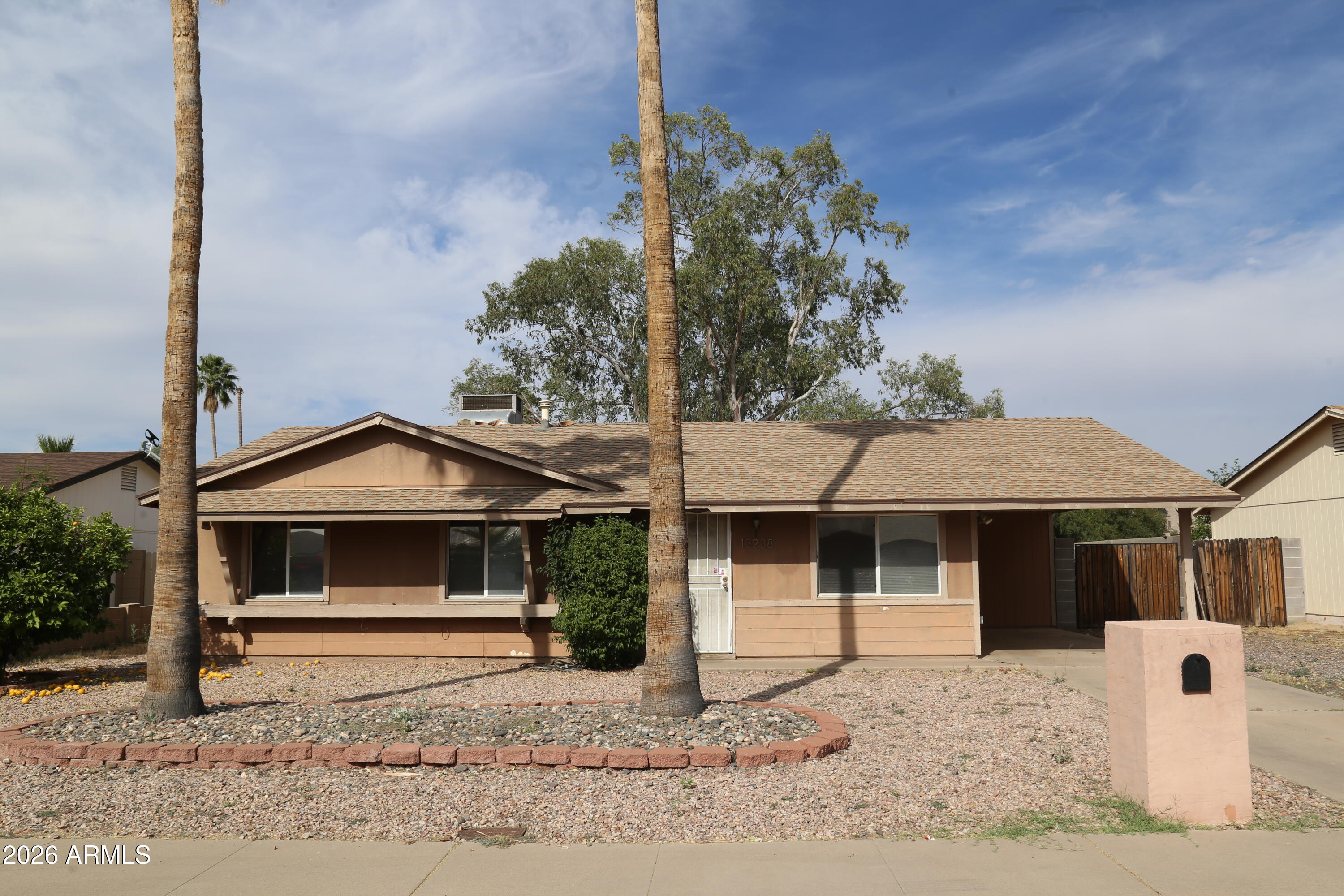 13238 North 38th Place Phoenix, AZ 85032 - Photo 1 of 19 a front view of a house with garden