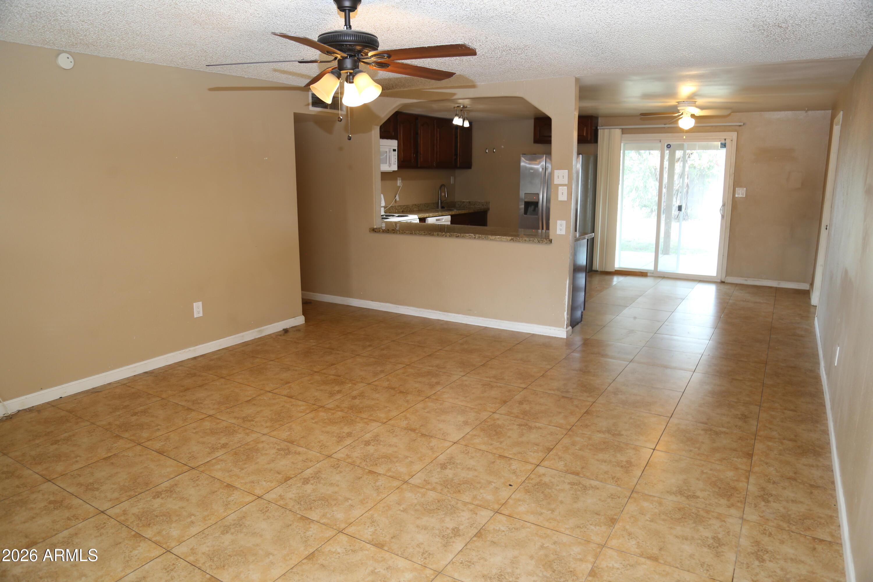 13238 North 38th Place Phoenix, AZ 85032 - Photo 12 of 19 a view of a hallway with a chandelier