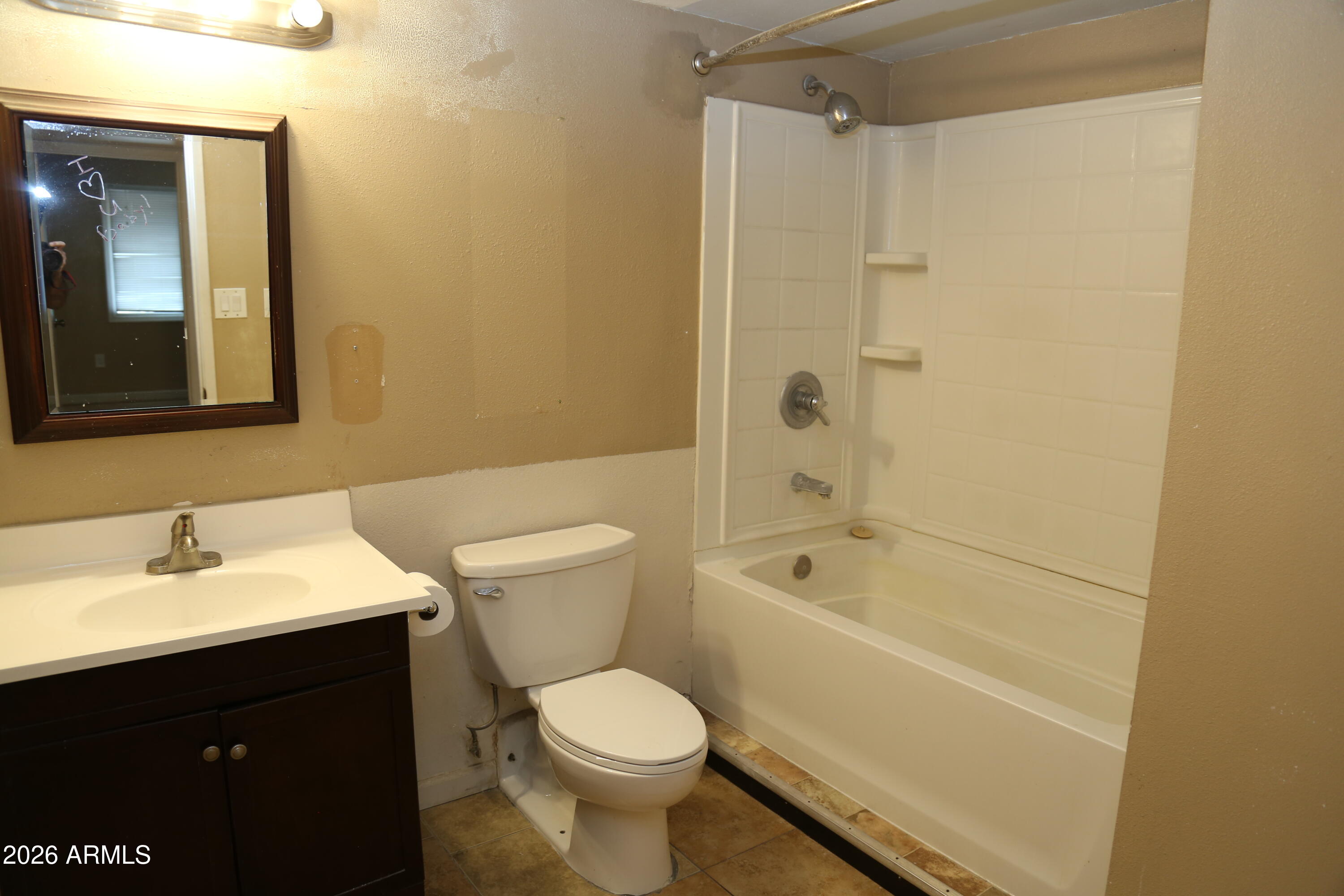 13238 North 38th Place Phoenix, AZ 85032 - Photo 15 of 19 a bathroom with a sink a toilet and shower