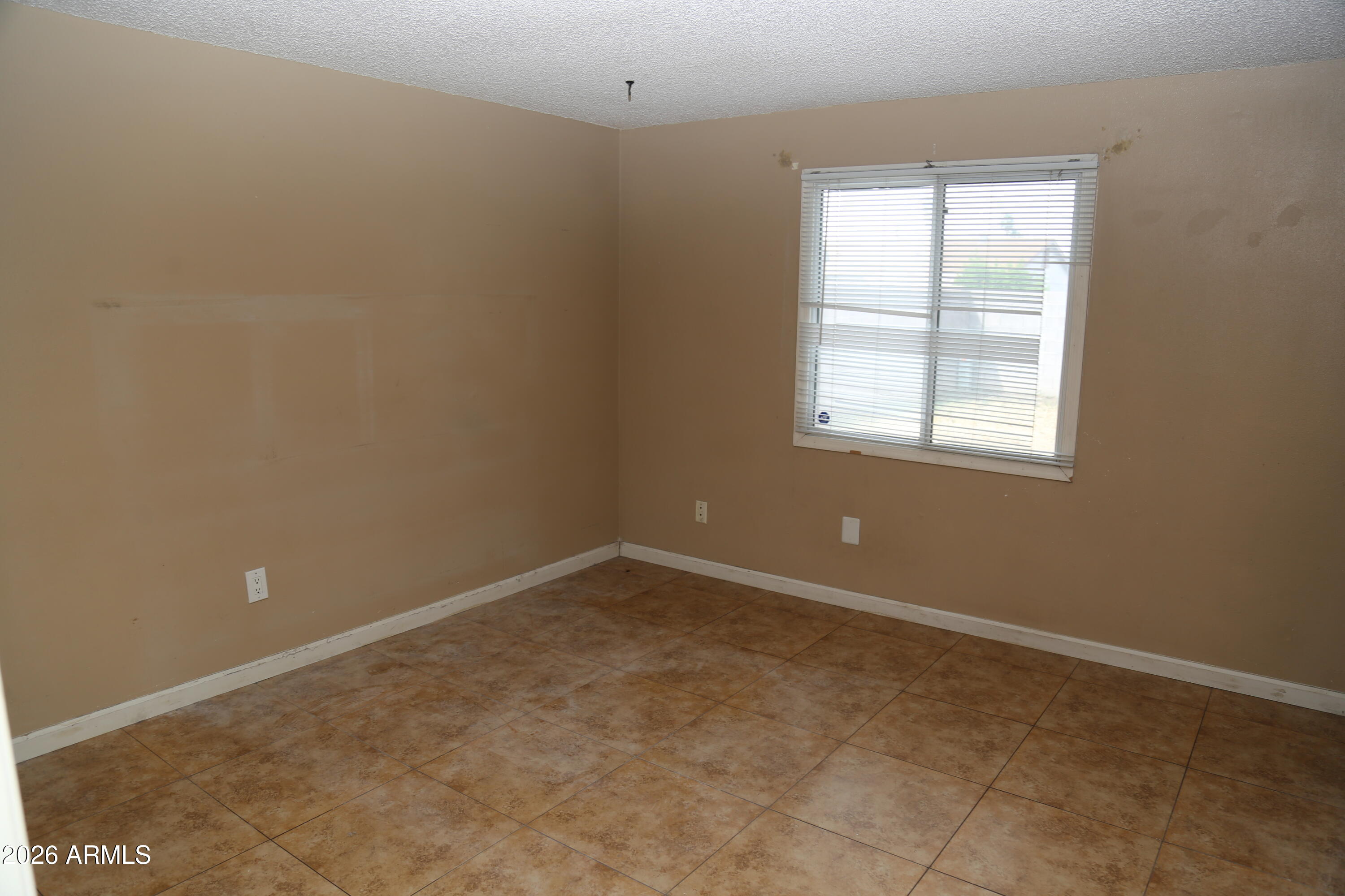 13238 North 38th Place Phoenix, AZ 85032 - Photo 16 of 19 an empty room with a window