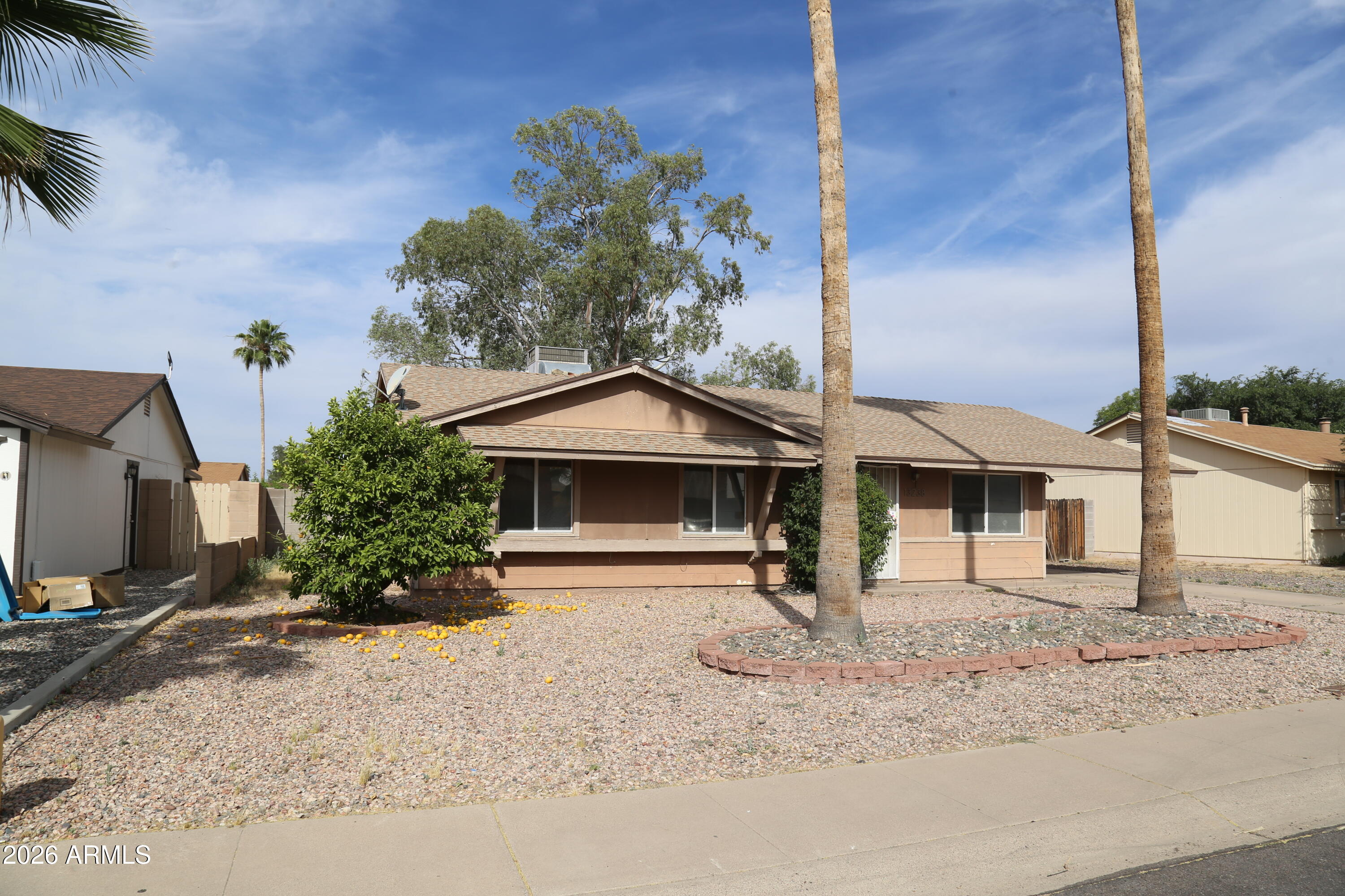 13238 North 38th Place Phoenix, AZ 85032 - Photo 3 of 19 a front view of a house with a yard