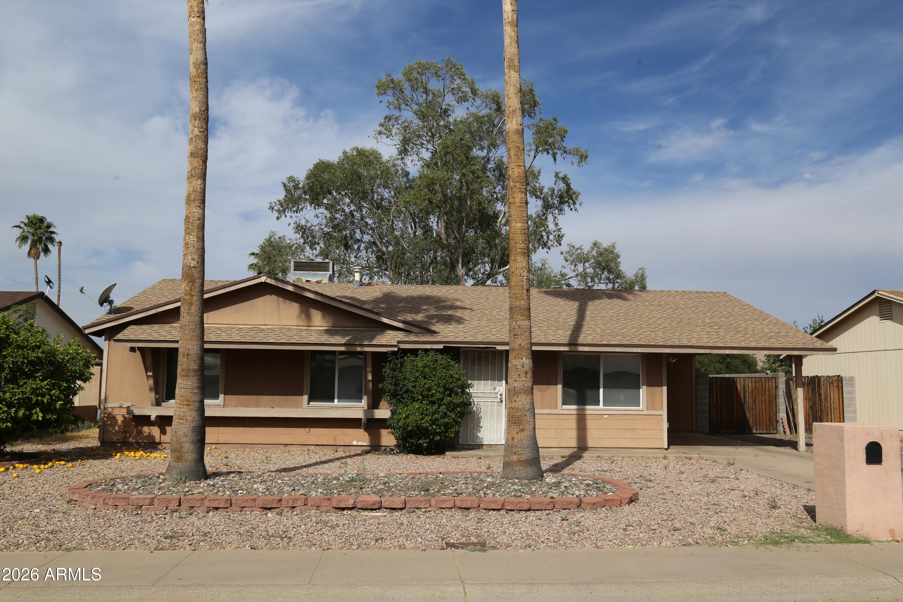 13238 North 38th Place Phoenix, AZ 85032 - Photo 4 of 19 a front view of a house with a yard