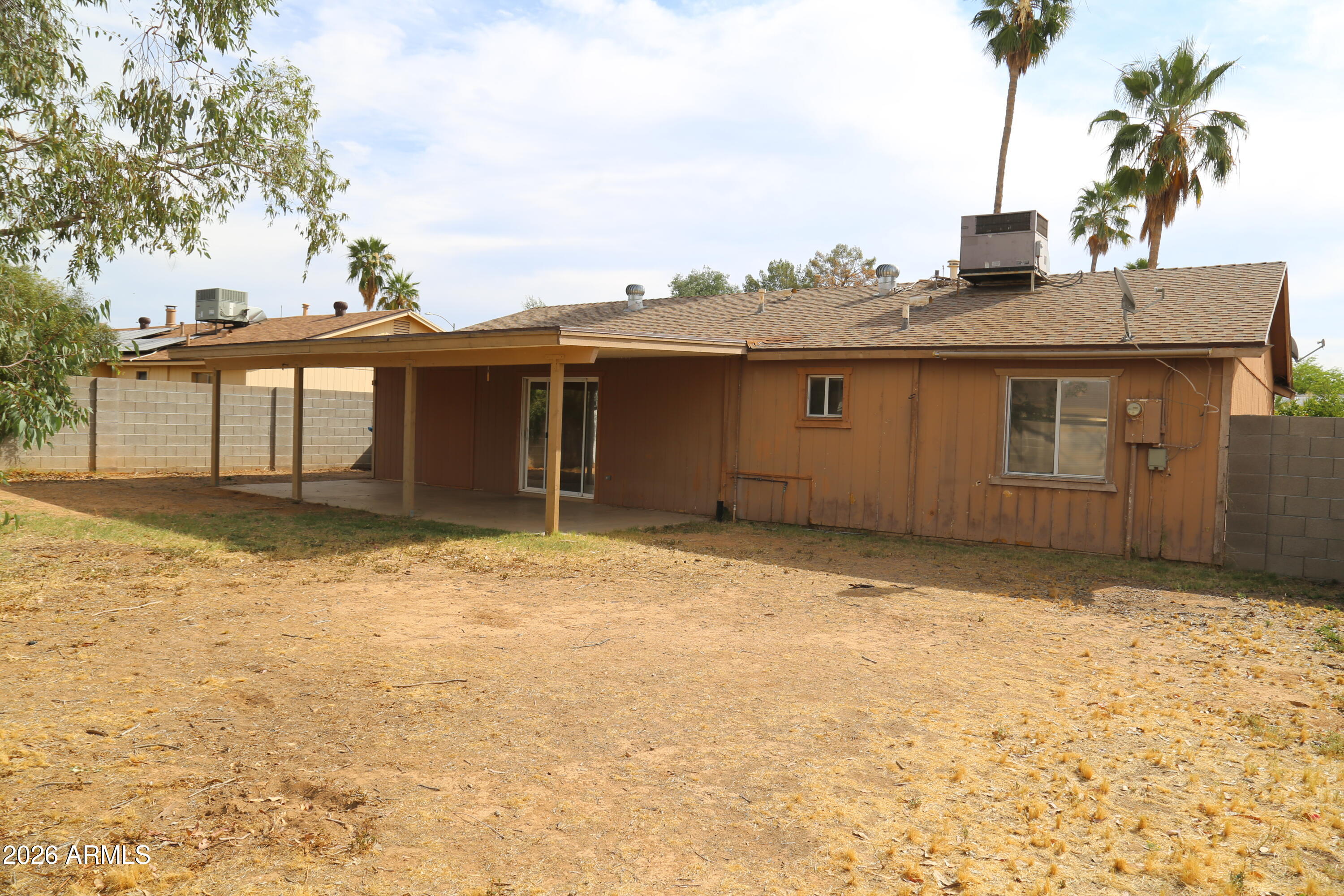13238 North 38th Place Phoenix, AZ 85032 - Photo 8 of 19 a house view with a backyard space