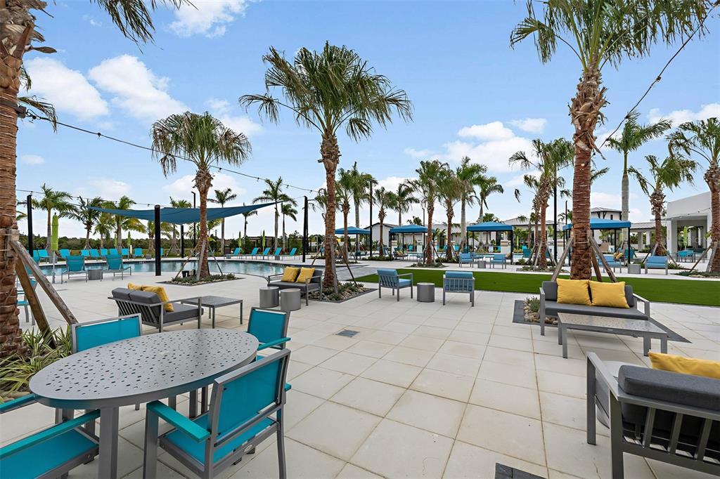 11296 Boundless Terrace Venice, FL 34293 - Photo 33 of 41 a view of a swimming pool and lounge chairs