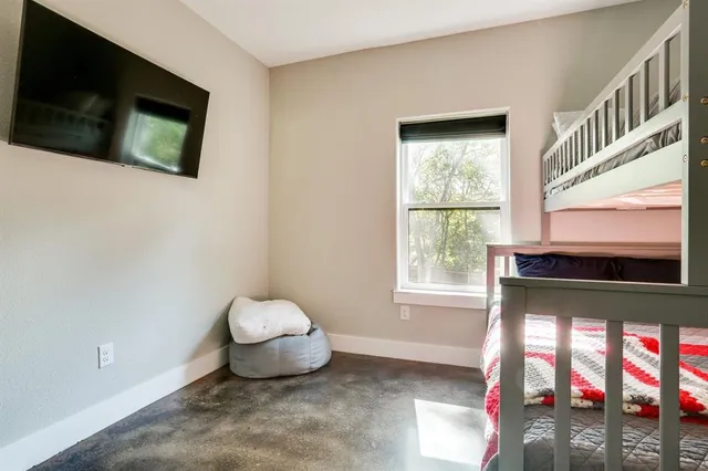 a room with window and a flat screen tv