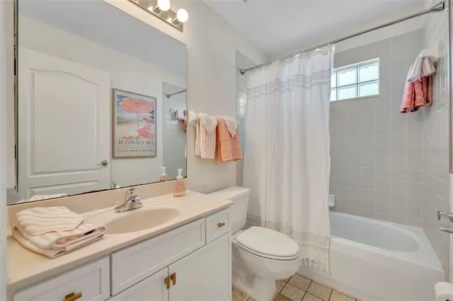 a bedroom with a large bed and a large window