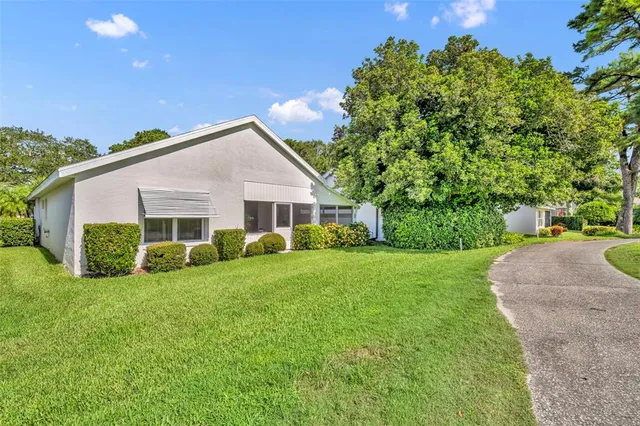 a view of a garden with a building in the background