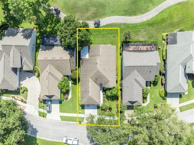 an aerial view of a house with a garden