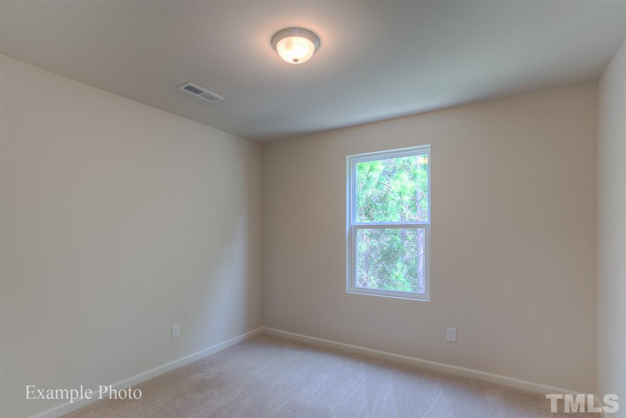9673 Jernigan Road Spring Hope, NC 27882 - Photo 14 of 24 an empty room with windows