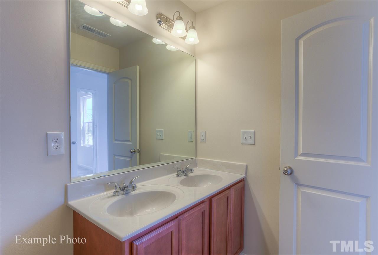 9673 Jernigan Road Spring Hope, NC 27882 - Photo 21 of 24 a bathroom with a sink and a mirror